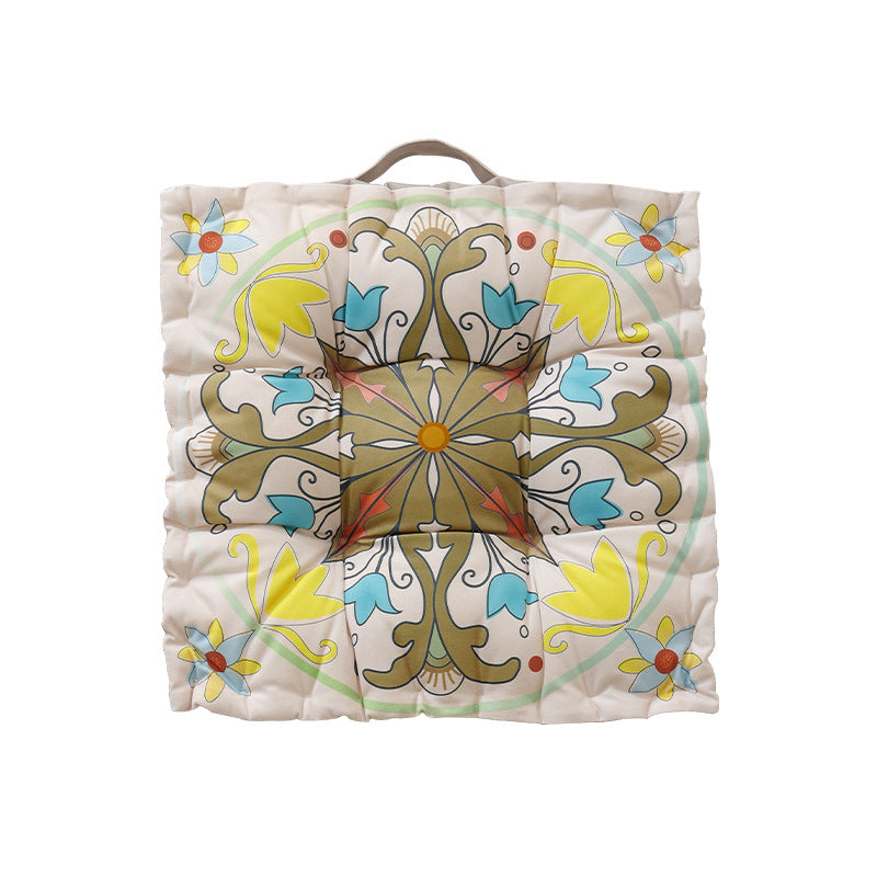 Round floor cushion with medal print, carrying handle and quilted padding