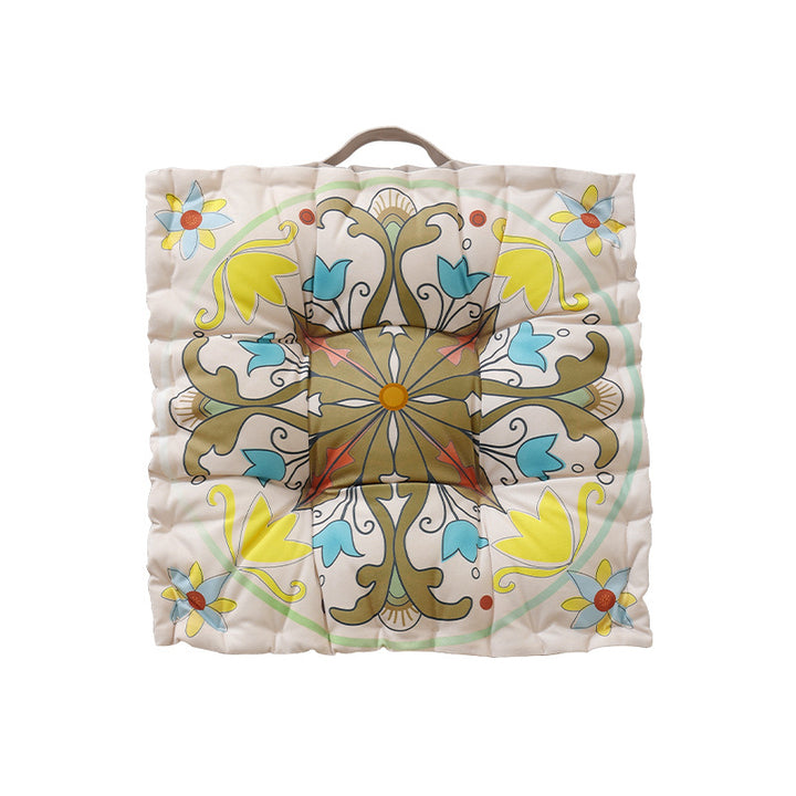 Round floor cushion with medal print, carrying handle and quilted padding