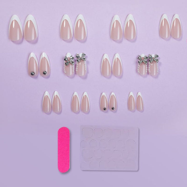 Artificial nail set with elegant French tips and decoration accents Stornfield