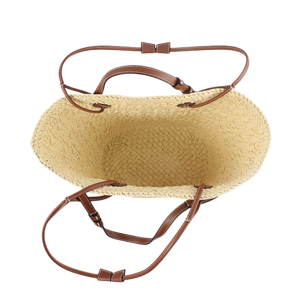 Elegant handbag made of woven natural material with sturdy leather handles Stornfield