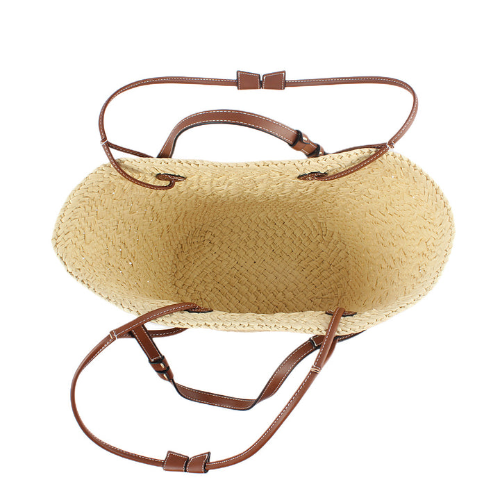Elegant handbag made of woven natural material with sturdy leather handles Stornfield