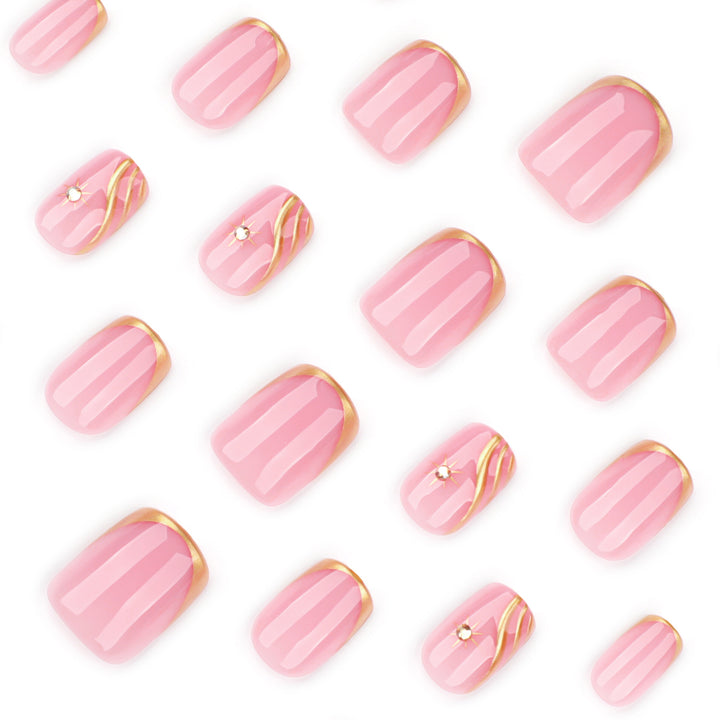 Artificial nail art with glamorous golden accents Stornfield
