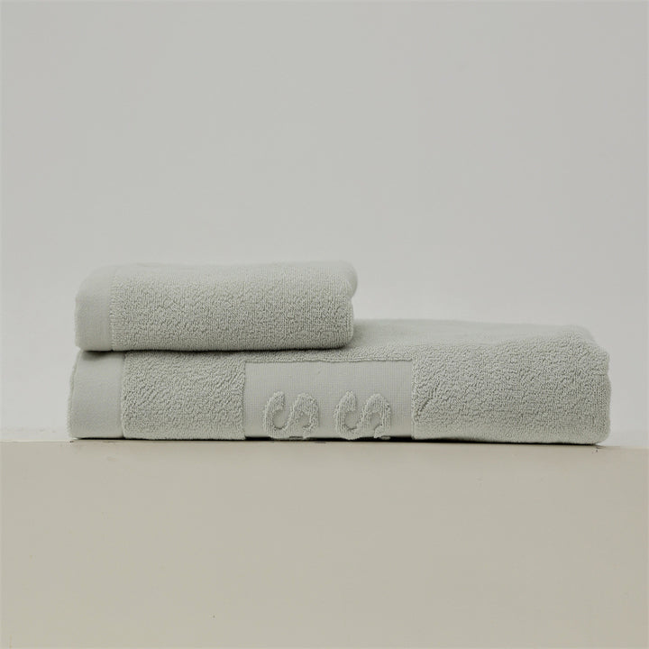 Luxury cotton terry towel set with logo border and extra soft Turquetto structure