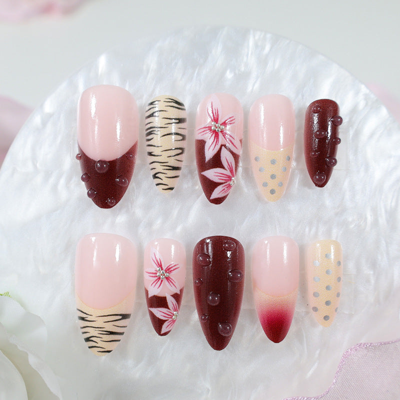 Artificial nail set with floral and animal designs Stornfield