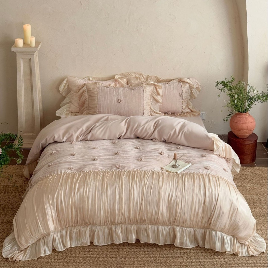 Satin look quilted bedspread with pleated ruffle and 3D flower appliqué