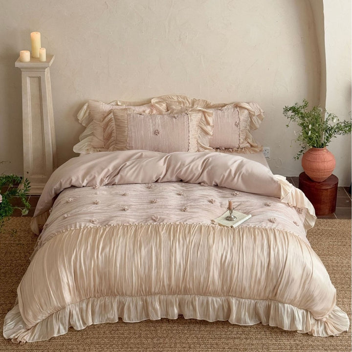 Satin look quilted bedspread with pleated ruffle and 3D flower appliqué