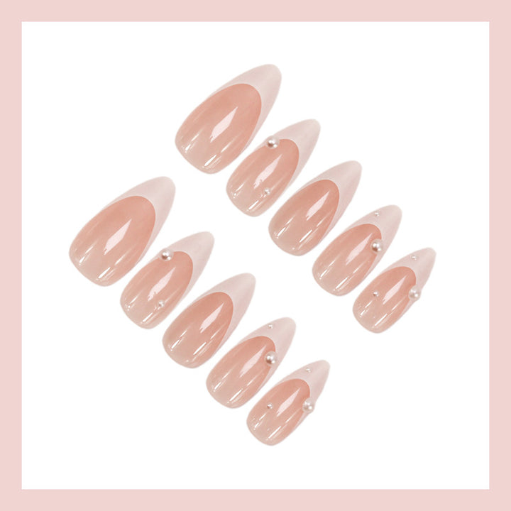 Artificial nail set with elegant French tip and shimmering pearl accents Stornfield