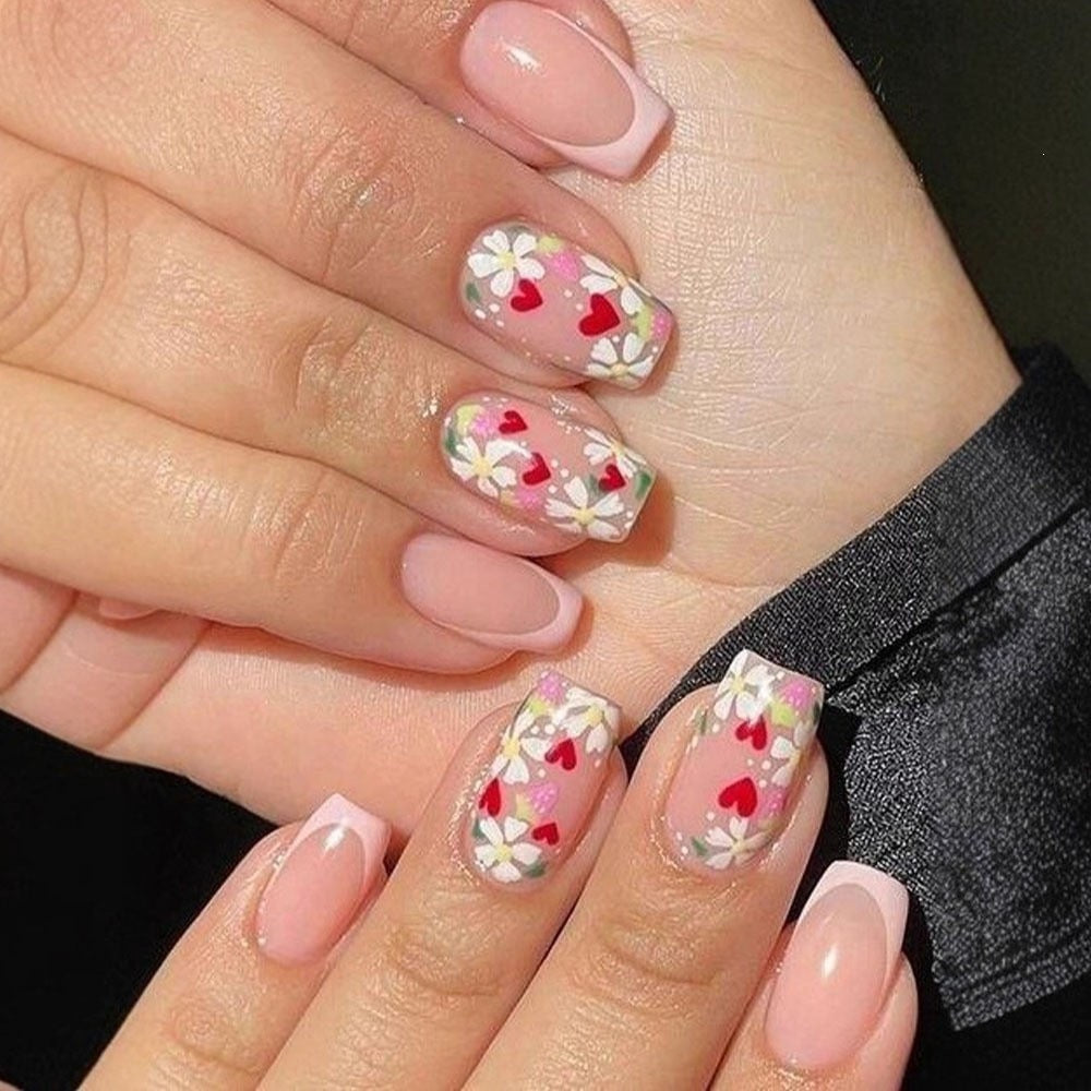 Artificial nails with romantic heart design and fine accents Stornfield