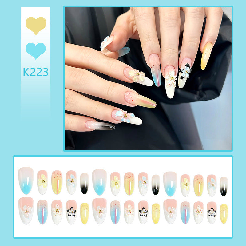 Artificial nail set with floral and glittering decorations Stornfield
