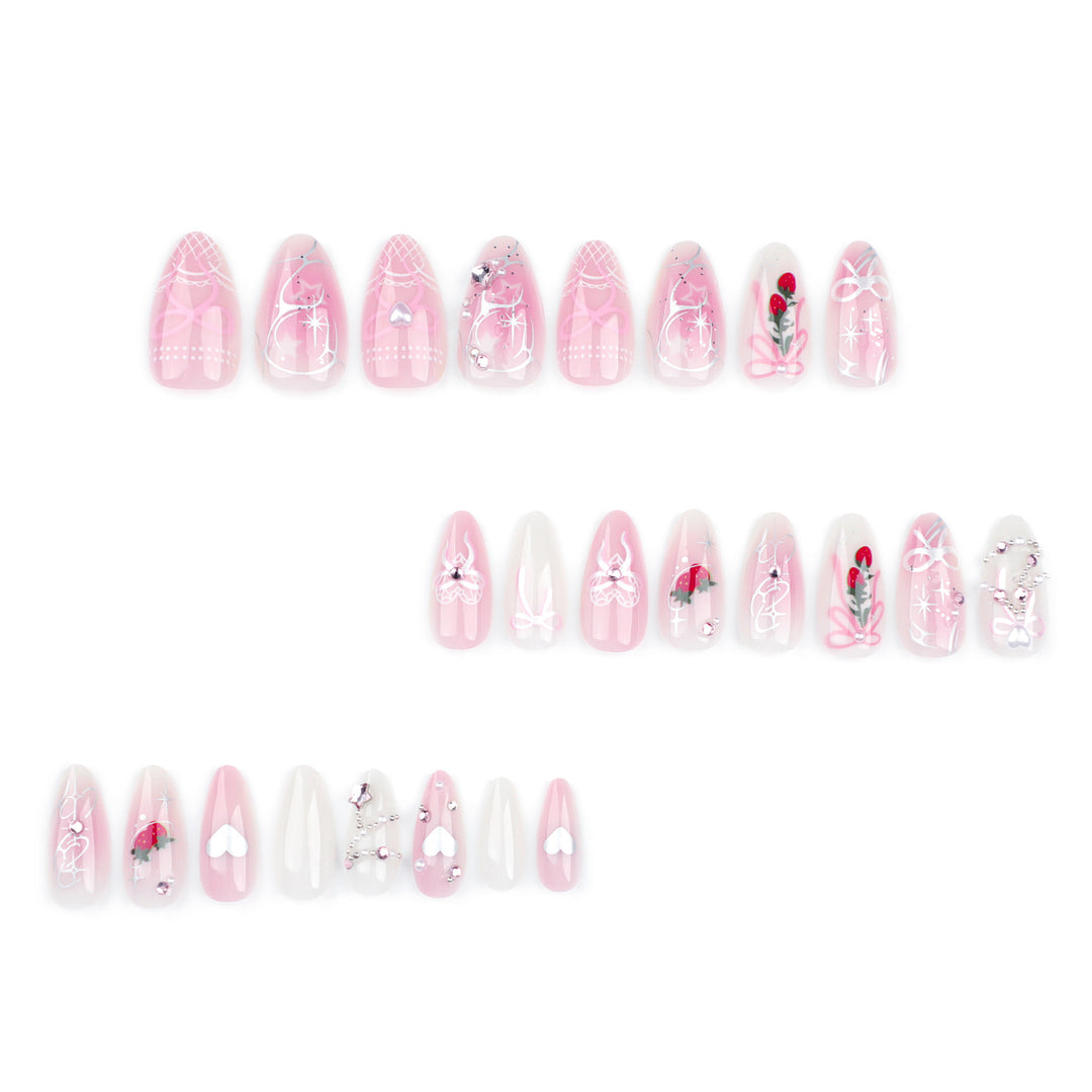Artificial nail art with romantic design and glitter accents Stornfield