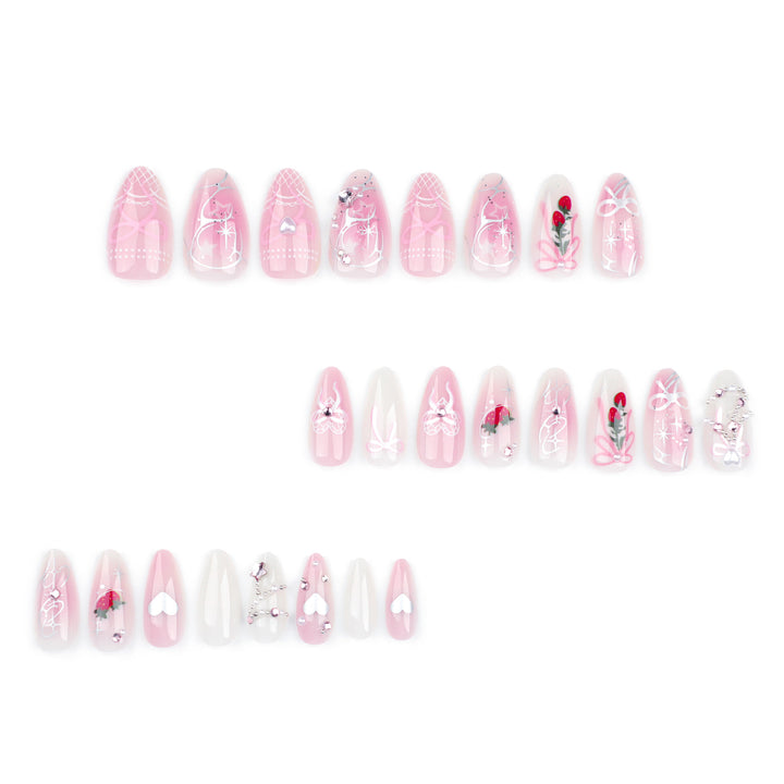 Artificial nail art with romantic design and glitter accents Stornfield