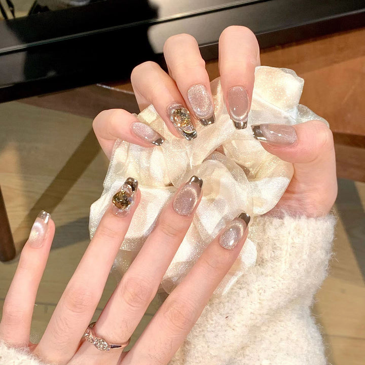 Artificial nail set with glamorous gold and glitter accents Stornfield