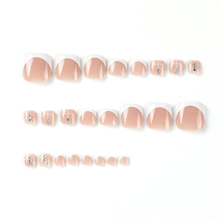 Artful toenail design with elegant style and rhinestone embellishments Stornfield