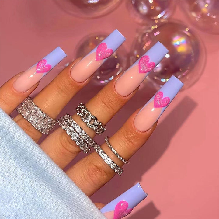 Artful stiletto nails with colorful heart designs Stornfield