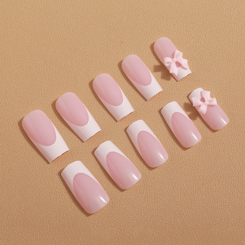 Art nail set with delicate bow decorations Stornfield