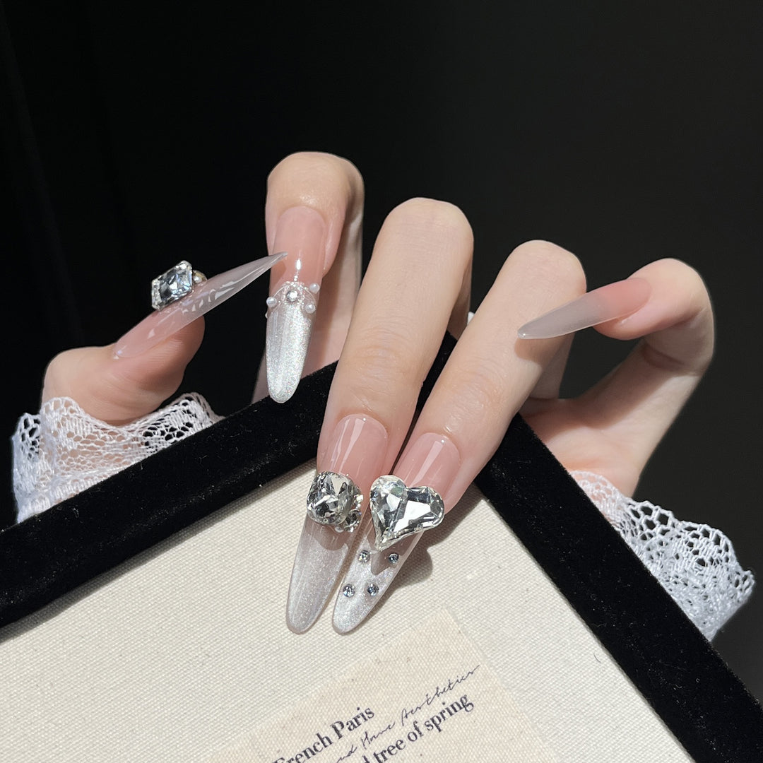 Artistic Stiletto Press-On Nail Art with Glimmering Accents Stornfield
