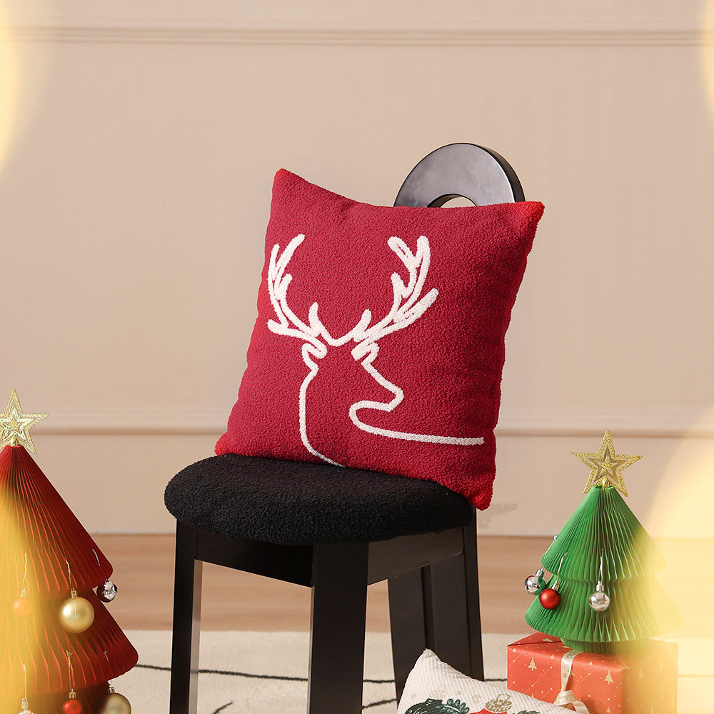Hand-stitched winter decorative sofa cushion with sled and fir motif