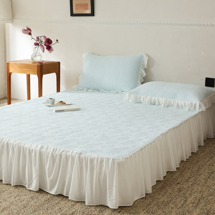 Bedding set with quilted mattress topper and ruffled skirt