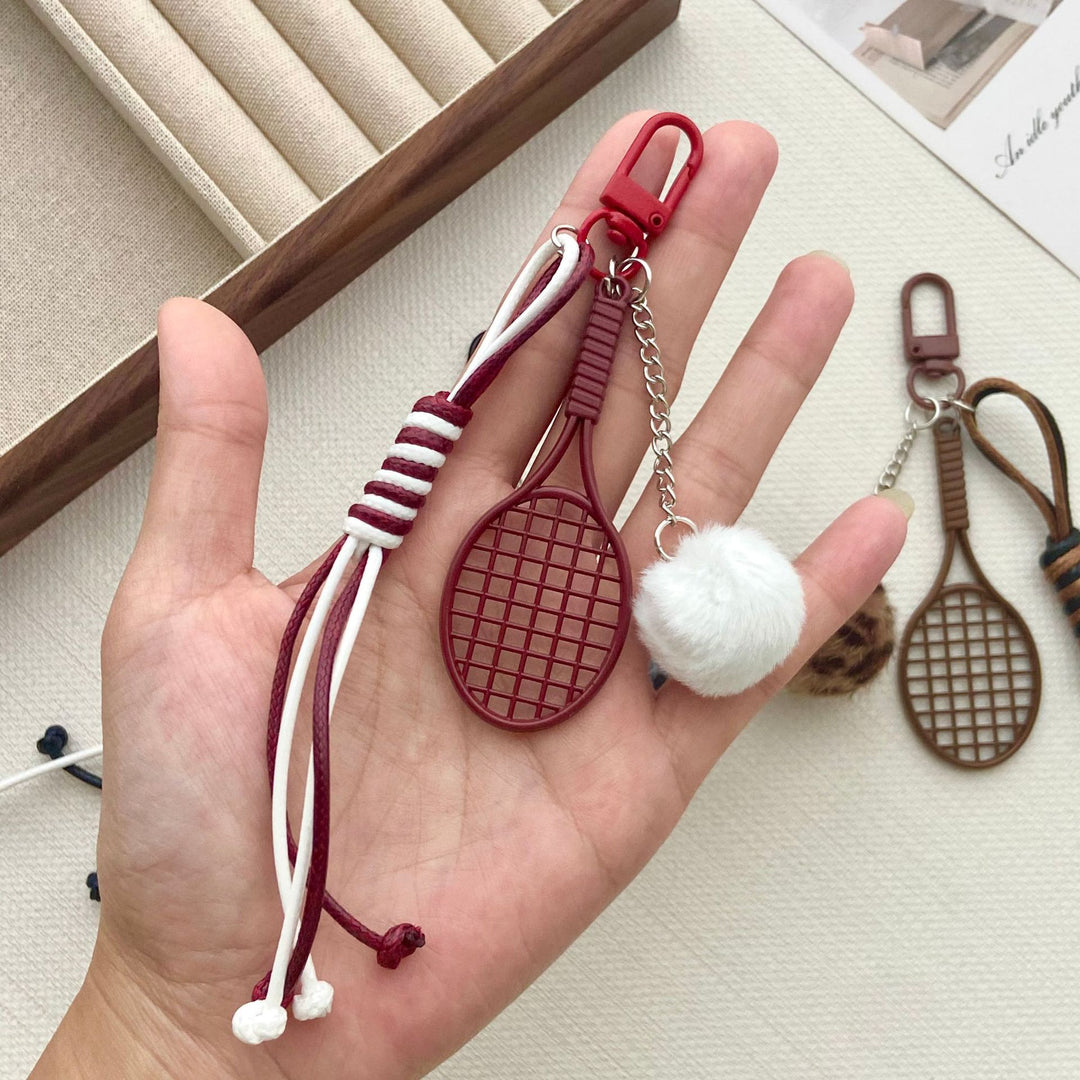 Tennis Racket and Fur Ball Keychain Stornfield