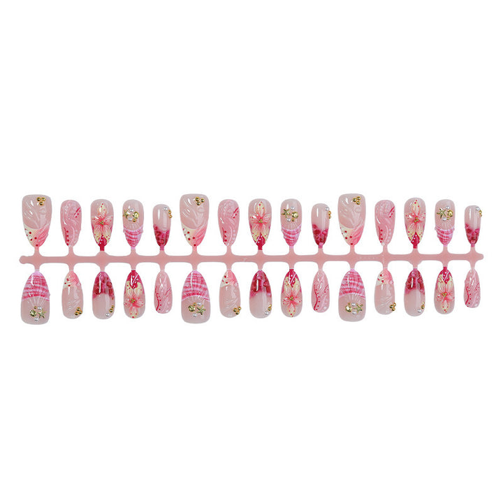 Creative nail art set with romantic flower pattern and sparkling accents Stornfield