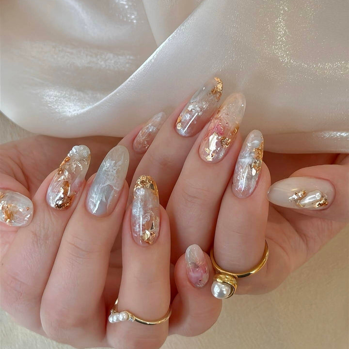 Artificial nails with glamorous metallic details and sparkling design Stornfield
