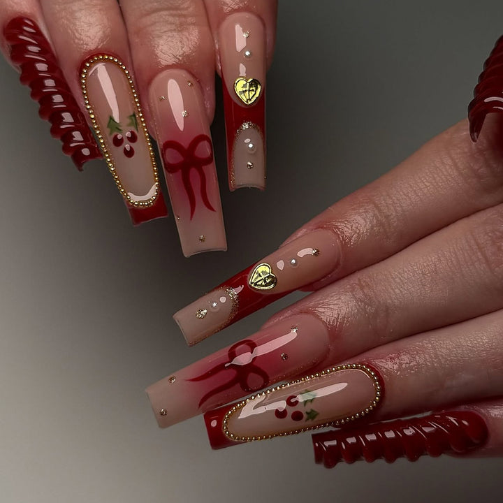 Artificial nail set with festive accents and glitter embellishments Stornfield