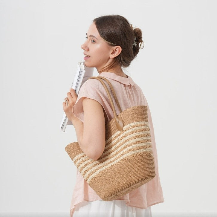 Beach bag made of natural woven material with elegant accents Stornfield