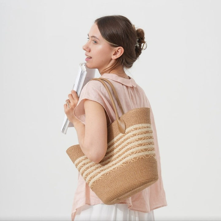 Beach bag made of natural woven material with elegant accents Stornfield