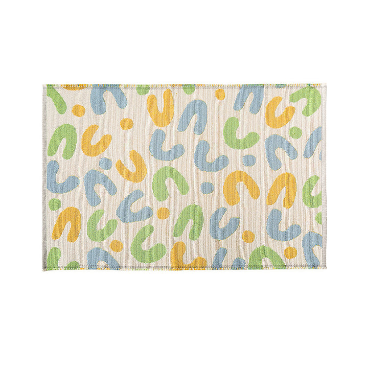 Flat-woven living room rug in a graphic tile pattern
