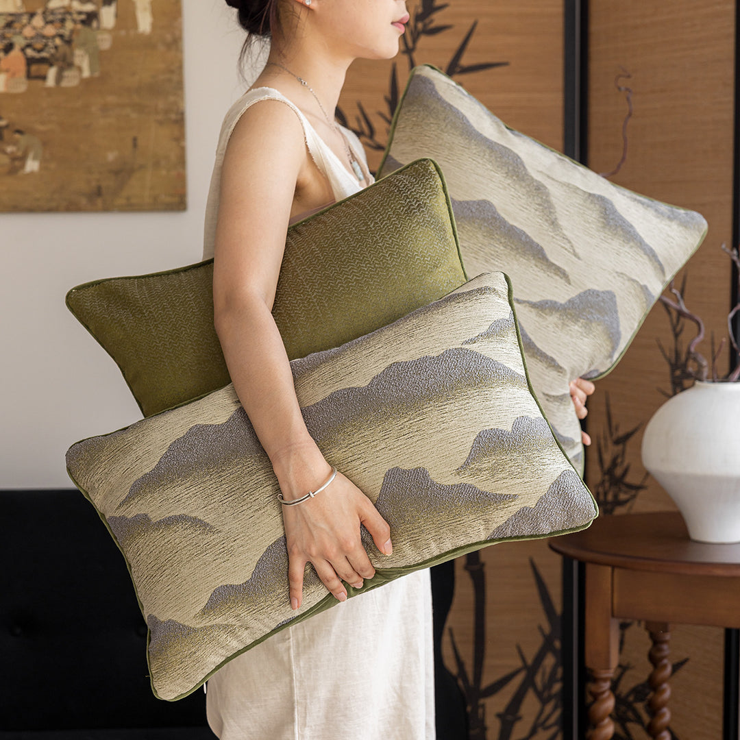 Elegant decorative pillow with elaborate mountain motif