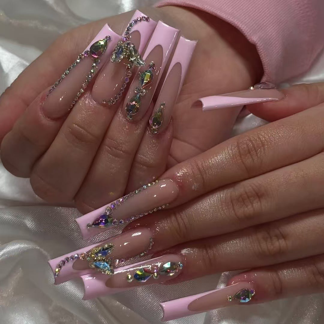 Acrylic nail set with elegant glitter and rhinestone accents Stornfield