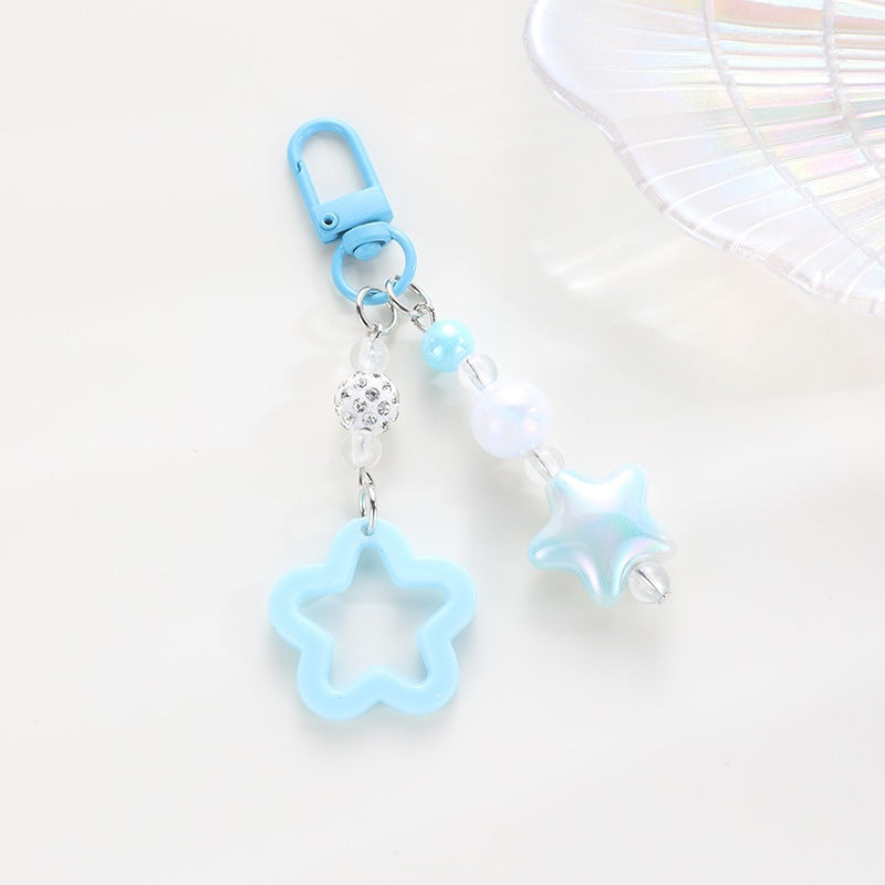 Playful keychain with floral and star motif Stornfield