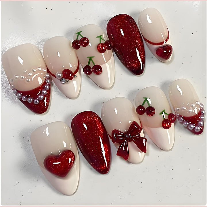 Artificial nail set with romantic berry designs and glamorous embellishments Stornfield