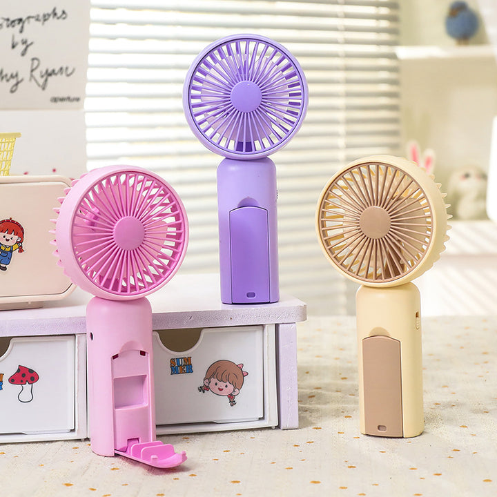 Women portable mini hand fan with USB charging function and ergonomic design Stornfield