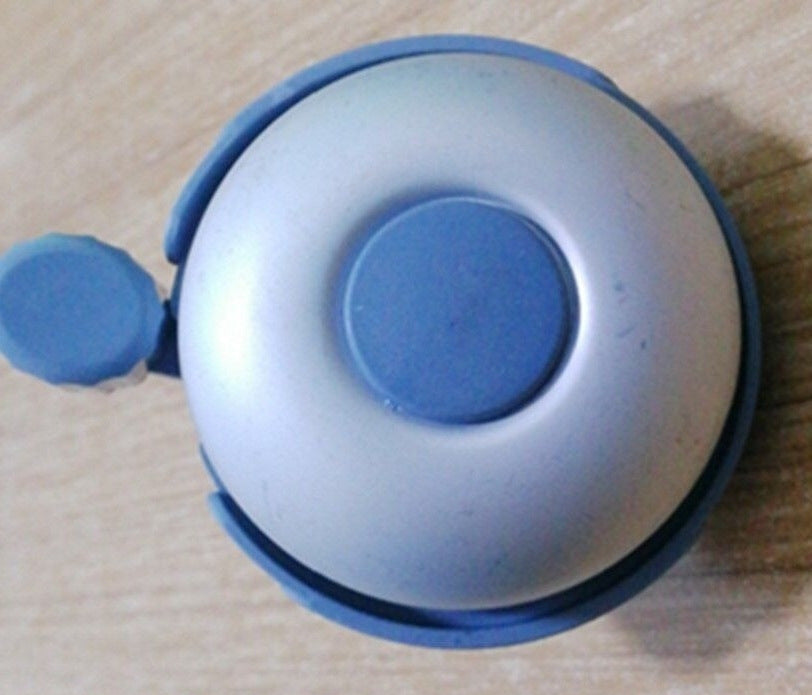 compact bicycle bell with quick-release handlebar mount Stornfield