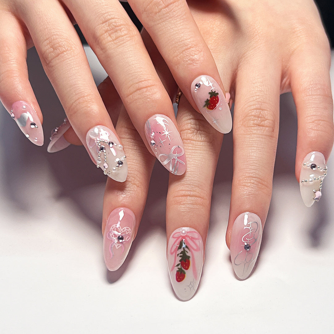 Artificial nail art with romantic design and glitter accents Stornfield