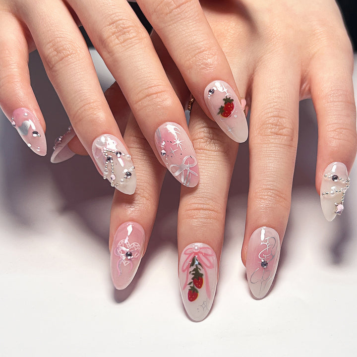 Artificial nail art with romantic design and glitter accents Stornfield