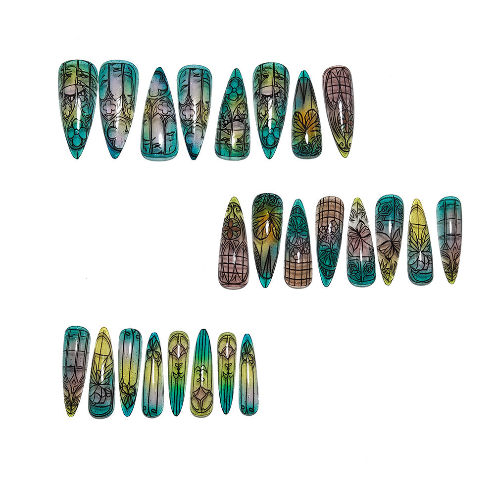 Artificial nails in elegant stiletto design with elaborate motifs Stornfield