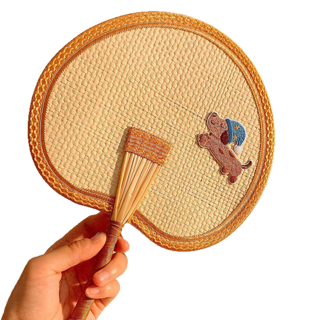 Handcrafted fan with playful dog motif Stornfield