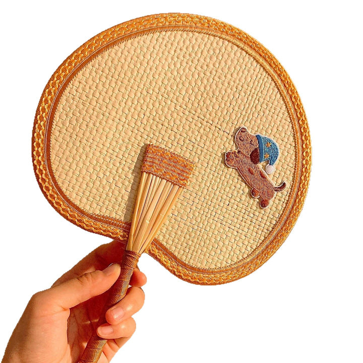 Handcrafted fan with playful dog motif Stornfield