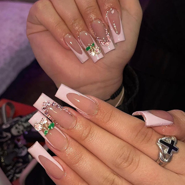 Creative acrylic nail set with delicate pearl and gloss accents Stornfield
