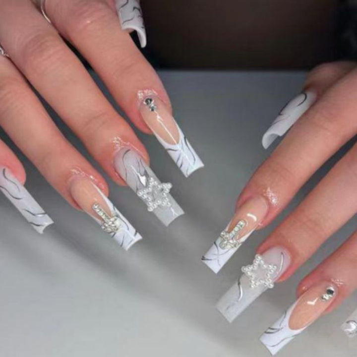 Artificial nails with luxurious marble design and radiant embellishments Stornfield