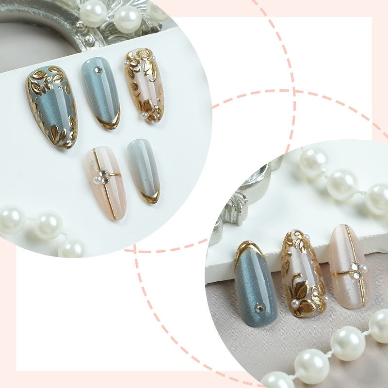 Artificial nail set with floral gold accents and elegant designs Stornfield