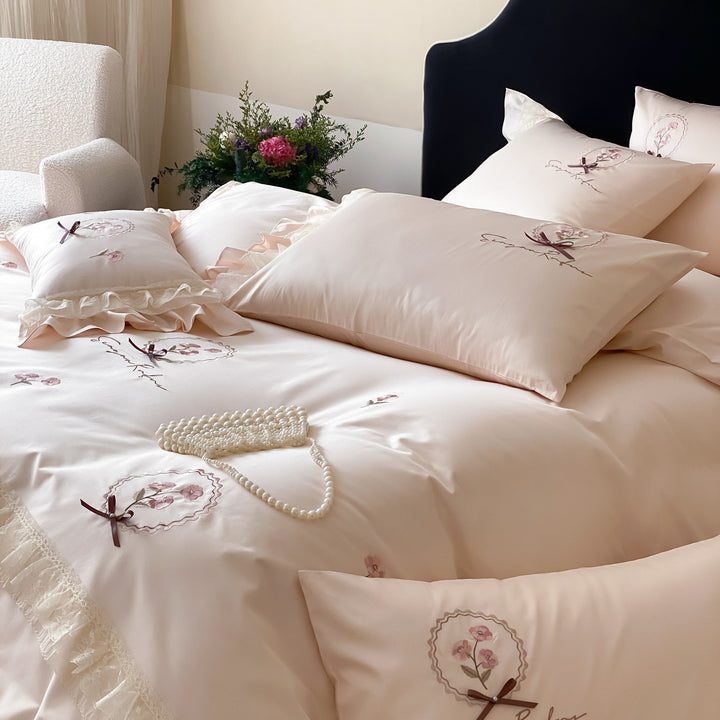 Bedding set made of cotton satin with frill ruffle, delicate flower embroidery and pillowcases