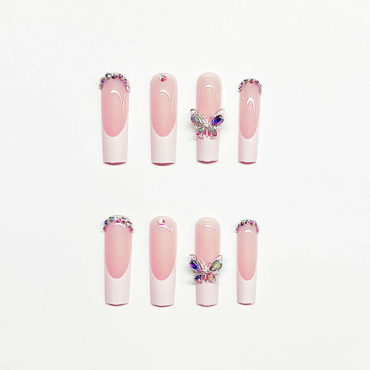 Acrylic nail set with elegant design and sparkling rhinestone accents Stornfield