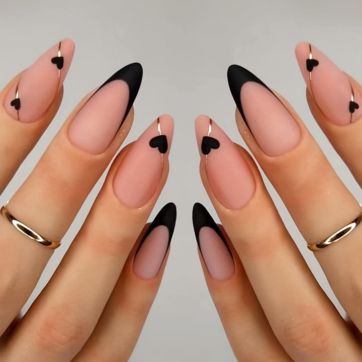 Creative nail art set with heart-shaped accents and elegant French tips Stornfield