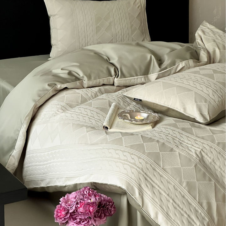 Structured bedding set with embossed cable pattern
