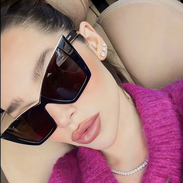 Women extravagant sunglasses with unique design and golden accents Stornfield