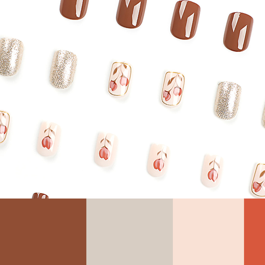 Artificial nail art with colorful flower design and glitter accents Stornfield