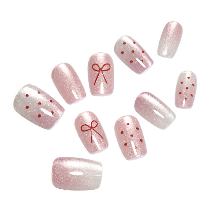 Artificial nail art with cute bow design Stornfield